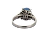 an image of a ring with a blue stone in the center