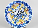 an image of a blue and white plate with a design on it