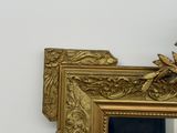 a clock that is sitting on top of a mirror