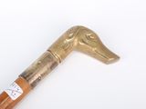 a wooden stick with a horse head on it