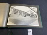 an open book with a picture of a train station on it
