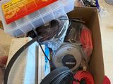 a box with headphones and other items sitting on a table