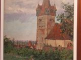 framed painting of a church in a rural setting with a person walking in the foreground