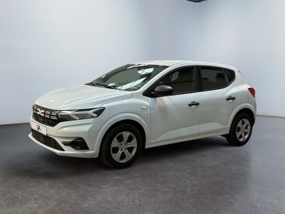 a white car is parked in a white room with a black floor