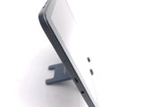 a close up of a cell phone on a stand