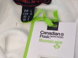a label on a white shirt that says canadian peak