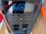 a radio that is connected to an orange cord
