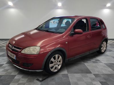 a picture of a red car parked in a garage