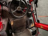 a view of the inside of a vehicle with the driver ' s seat up