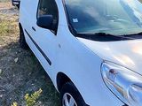a white van that is parked in the grass