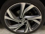 a close up of a tire on a car ' s rim