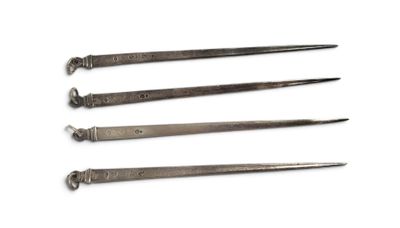 four different types of tools are shown on a white surface