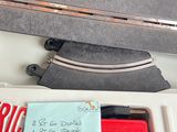 a piece of luggage sitting on a table with a note attached to it