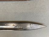 two knives that are on a table next to each other