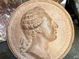 a close up of a coin sitting on top of a table
