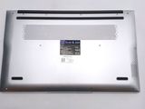 a close up of a silver laptop with a small screen
