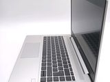 a laptop computer sitting on top of a white table