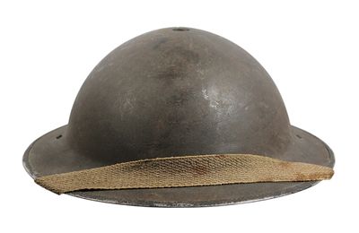 an old helmet with a rope around it on a white background