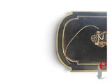 an image of a black and gold plated box with a pair of earrings