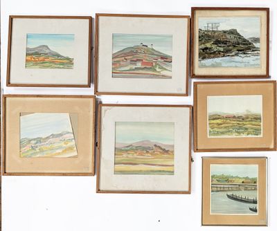 a lot of paintings on the wall of a room