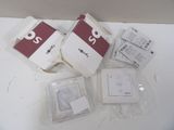 four packages of electronic devices sitting on a table