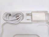 a white box with a charger and a charger on it