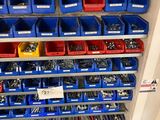 many blue bins and red bins on the wall