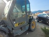 a tractor that is parked on the side of the road