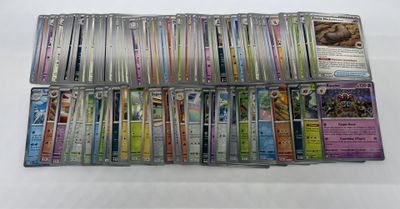a large collection of pokemon trading cards are displayed on a table