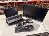 two laptops and a keyboard on a table