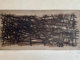 une image représentant une œuvre d'art accrochée à un mur