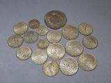 a lot of coins that are on the table