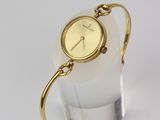 an image of a close up of a wrist watch on a stand