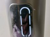 someone is taking a picture of themselves in the mirror of a blender