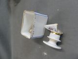 a small white box with a gold trim and a small blue and white box with a gold trim