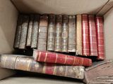 a box full of old books sitting on a table