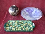 two vases and a plate on a table
