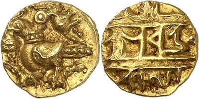 a gold coin with an image of a bird on it