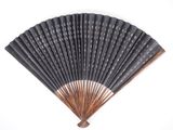 a close up of a black fan on a white background