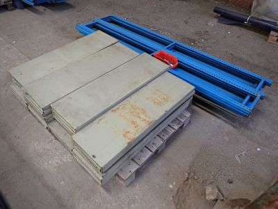 a pile of wood sitting on a pallet in a warehouse