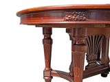 an image of a wooden table with a carved top