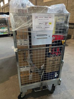 a metal cart with a sign on it in a warehouse