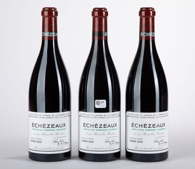trois bouteilles de vin rouge posées côte à côte sur une table