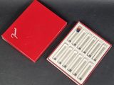 a red box that has a set of six cigarettes in it