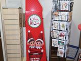 an elf on a shelf in the corner of a room