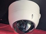 an image of a security camera mounted on the side of a building