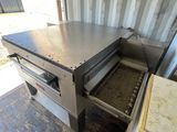an open oven that is sitting in the back of a truck