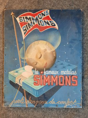 a sign that says simmons on it on the floor