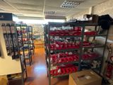 a room with a lot of shelves and boxes on it