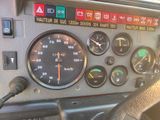 a close up of a dashboard with various gauges on it